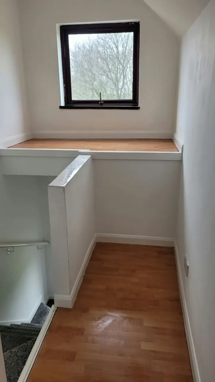 Clean, bright landing with wiped skirting boards and a polished wooden floor